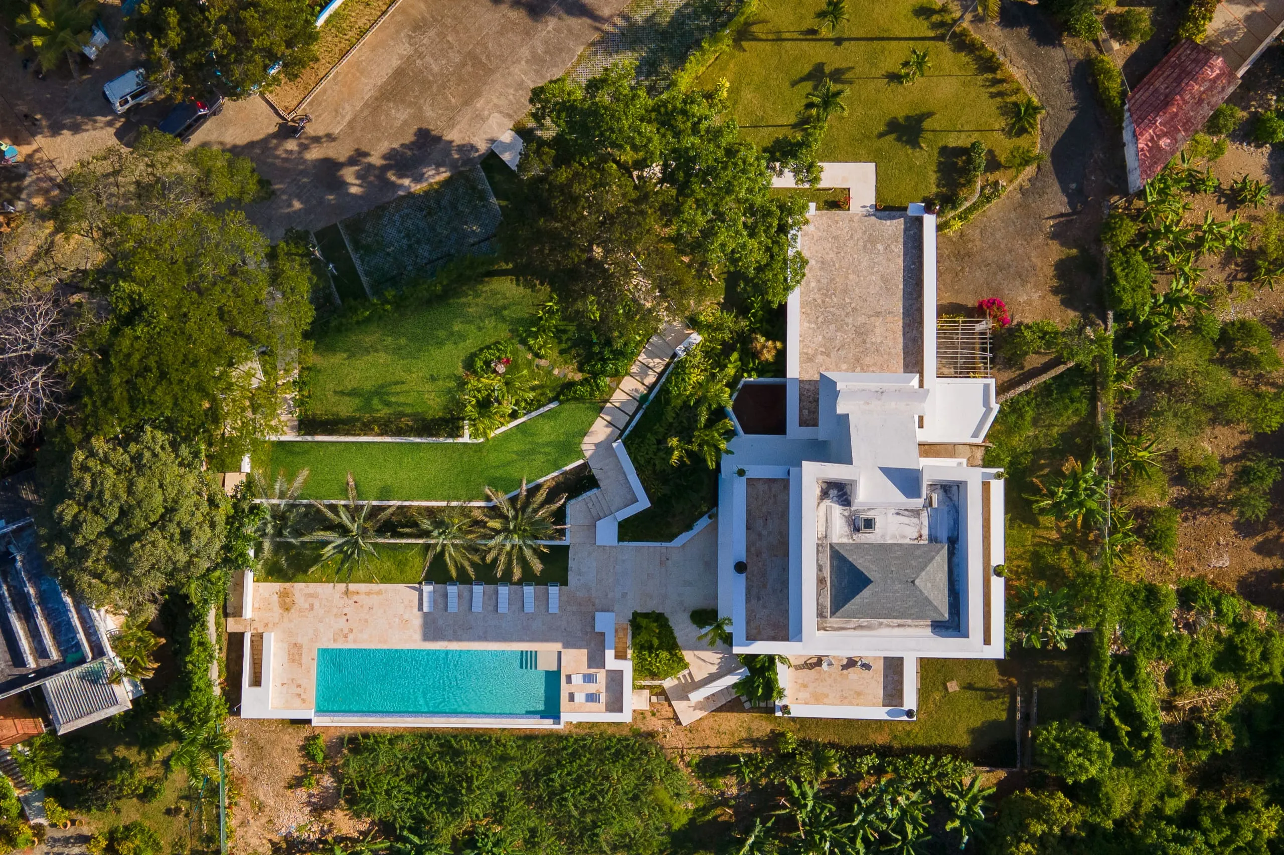 Aerial view of the pool terrace with the ocean beyond