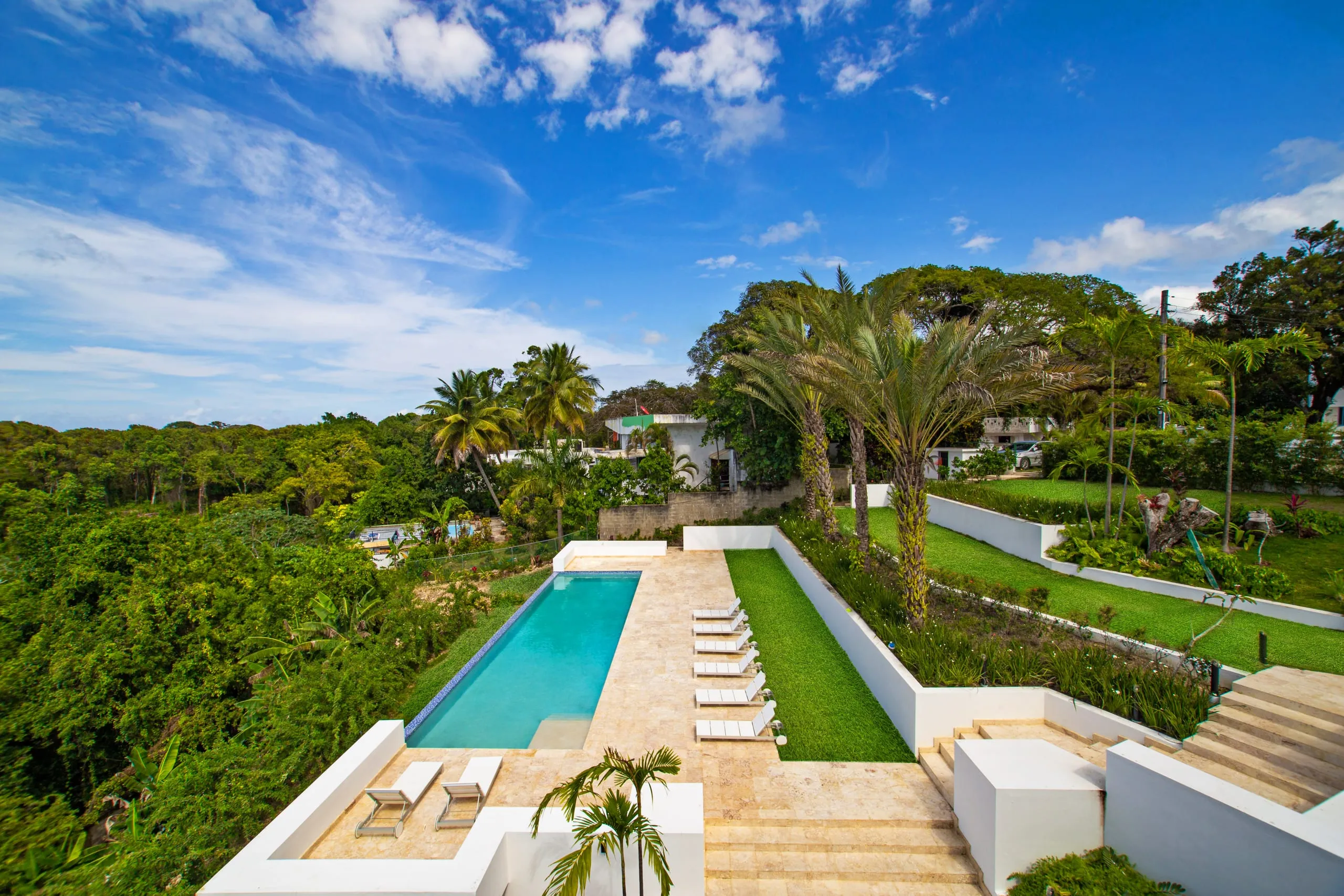 Pool and sun loungers overlooking the ocean
