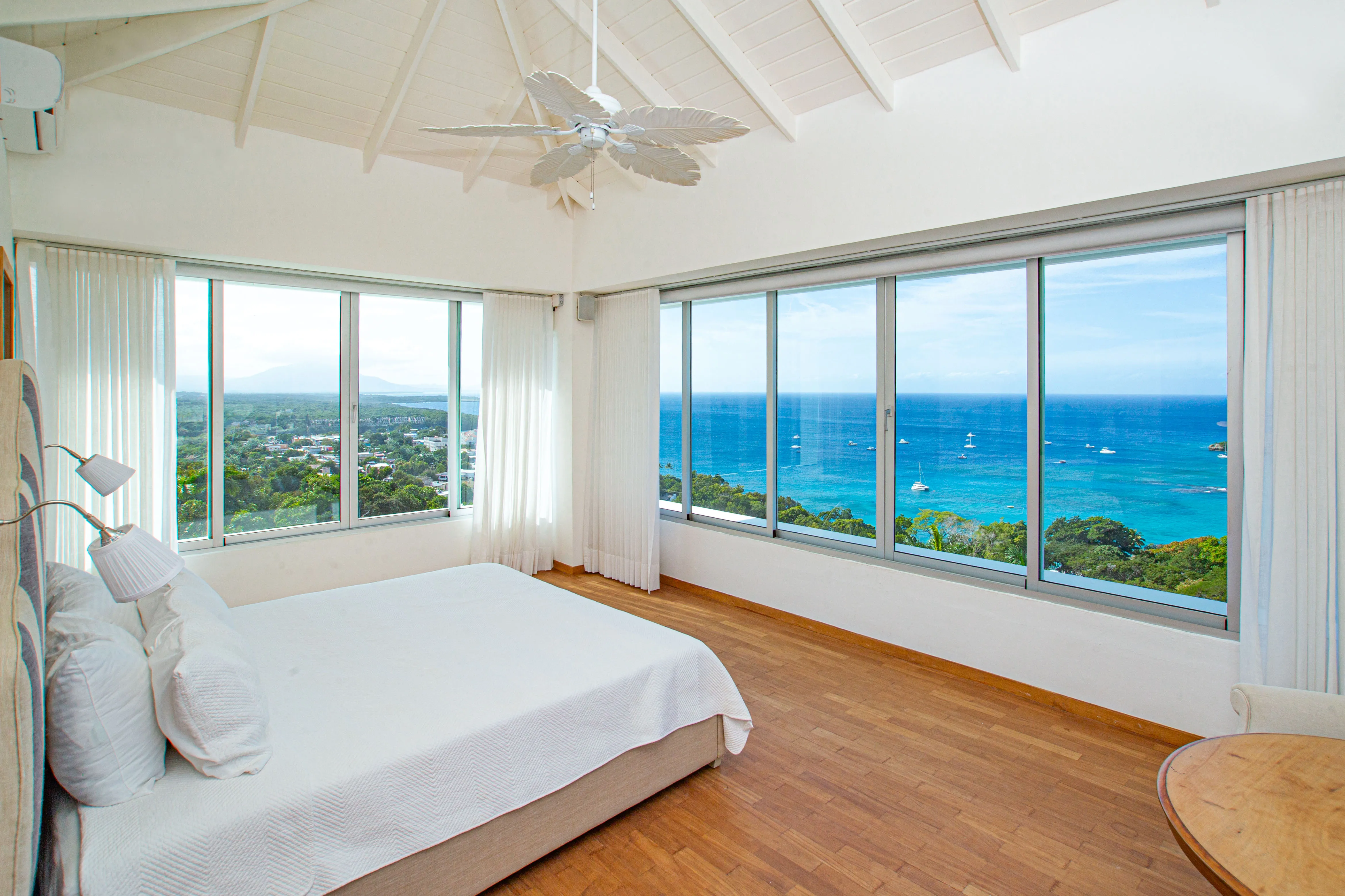 Primary suite with a vaulted ceiling and 270° views over the ocean